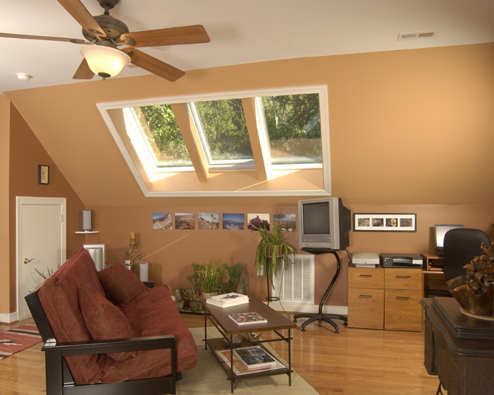 Finished attic remodel with painted ceilings and built-in storage