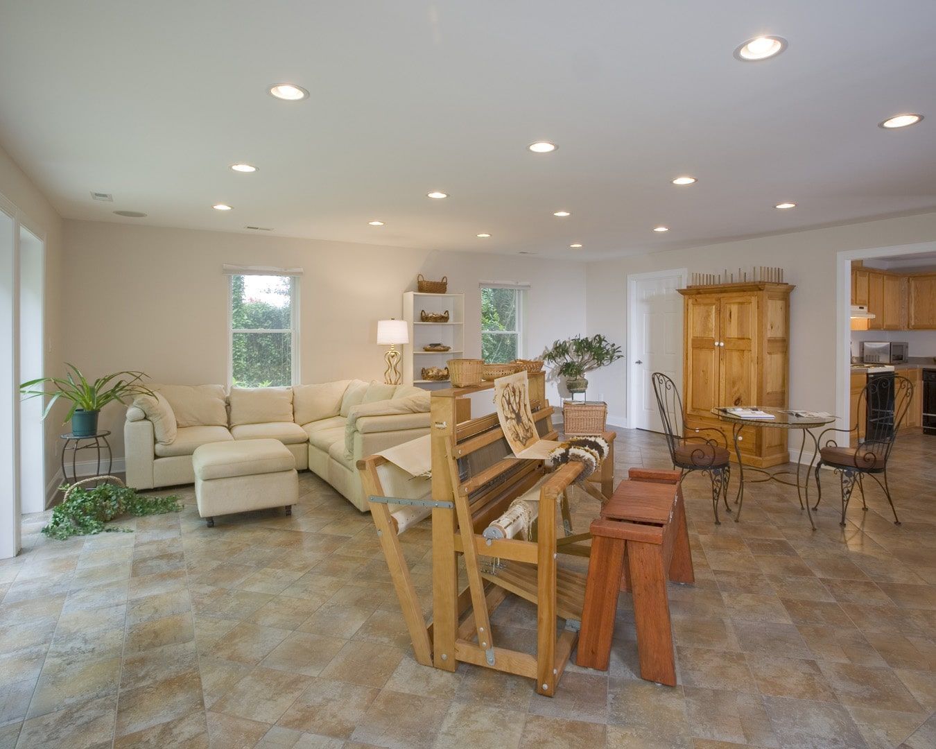 Finished basement with recessed lighting and a built-in media wall