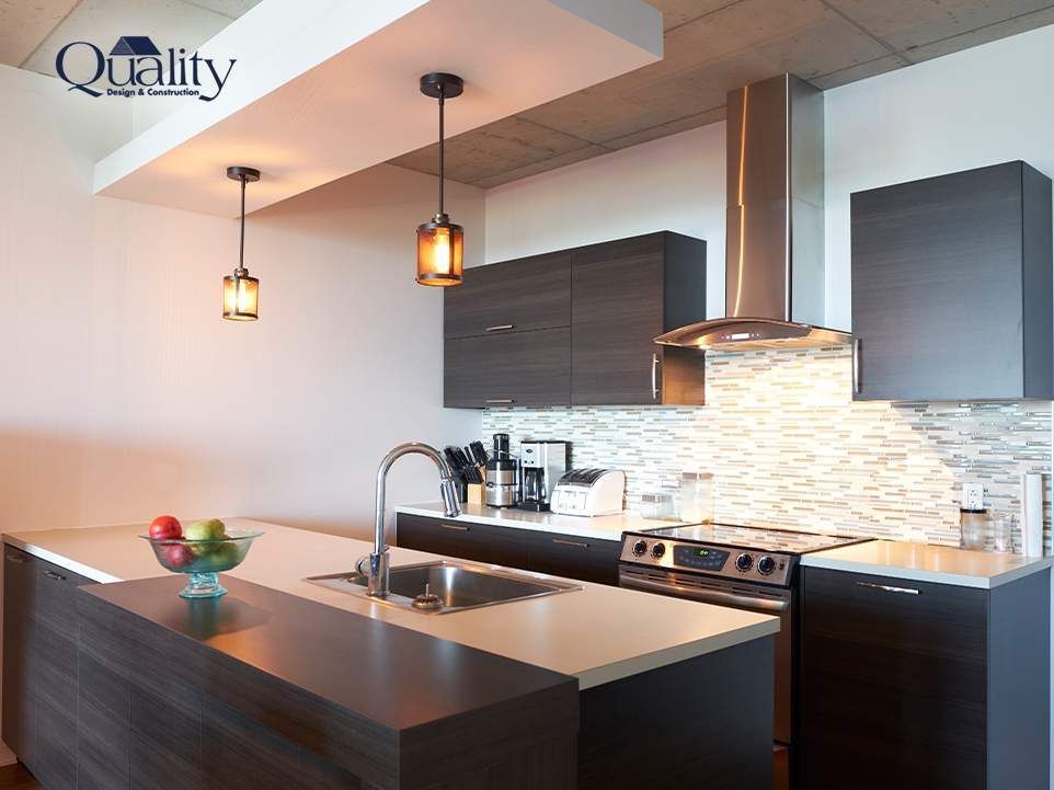Pendant lights hanging over a kitchen island