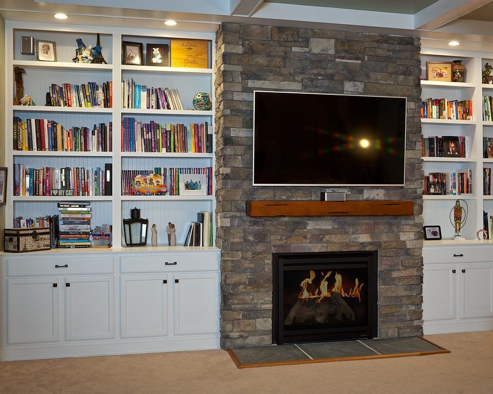Custom stone fireplace built as the focal point of a living room