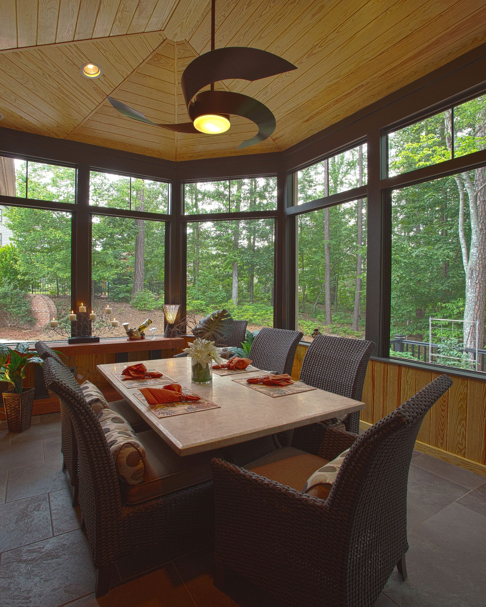Sunroom addition with full-height glazing overlooking the garden
